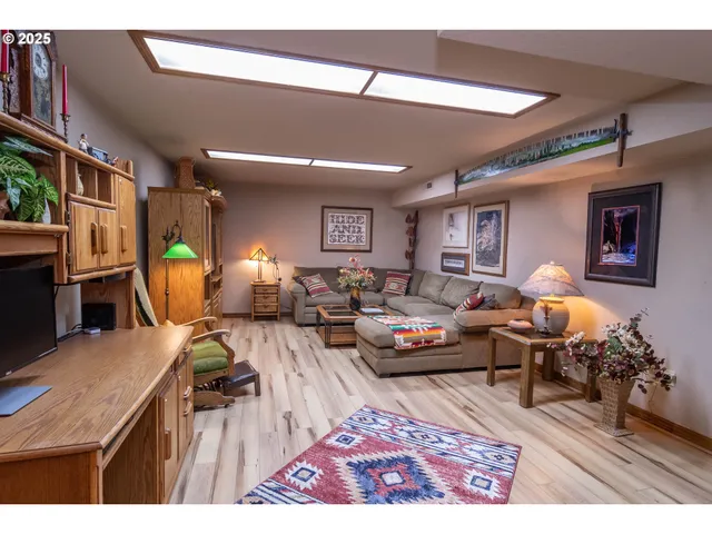 a living room with furniture and kitchen view