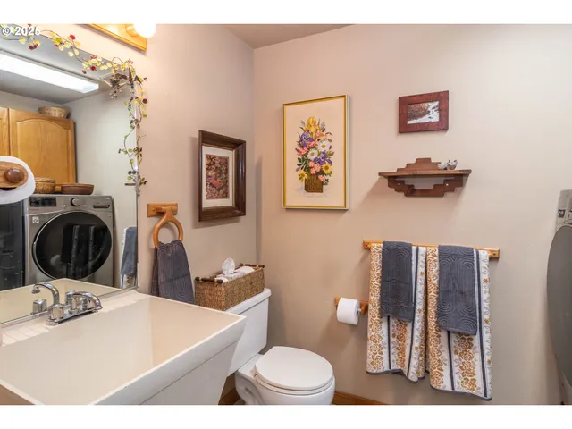 a view of a hallway with a washer and dryer