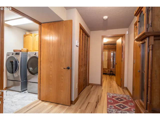 a bedroom with a bed and large windows