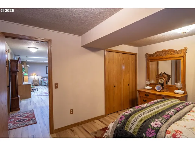 a view of a patio with furniture and a garden