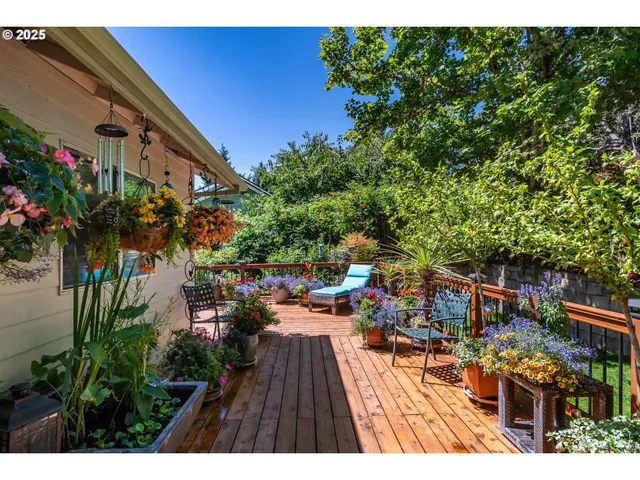 a view of a chairs and table in patio
