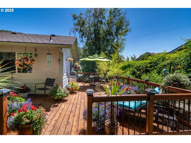 a backyard of a house with table and chairs