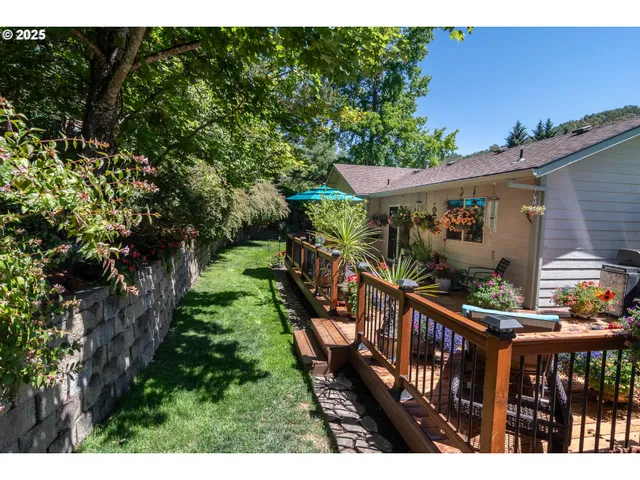 a view of a chairs and table on the wooden roof