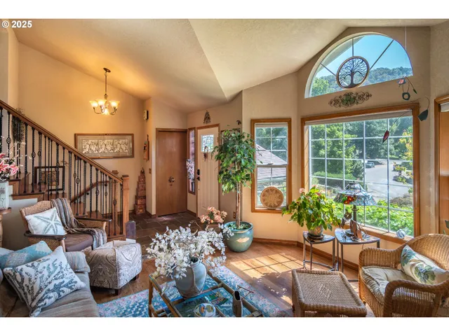 a view of living room with furniture and a potted plant