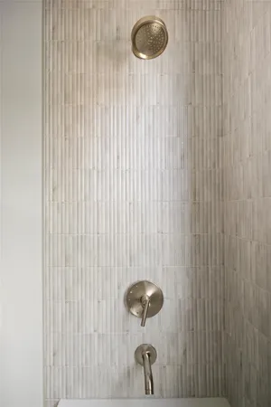 a bathroom with a bathtub and a shower