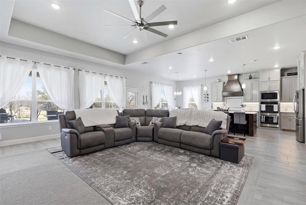 3036 Deer Path Weatherford, TX 76085 - Photo 13 of 35 a living room with furniture and a large window