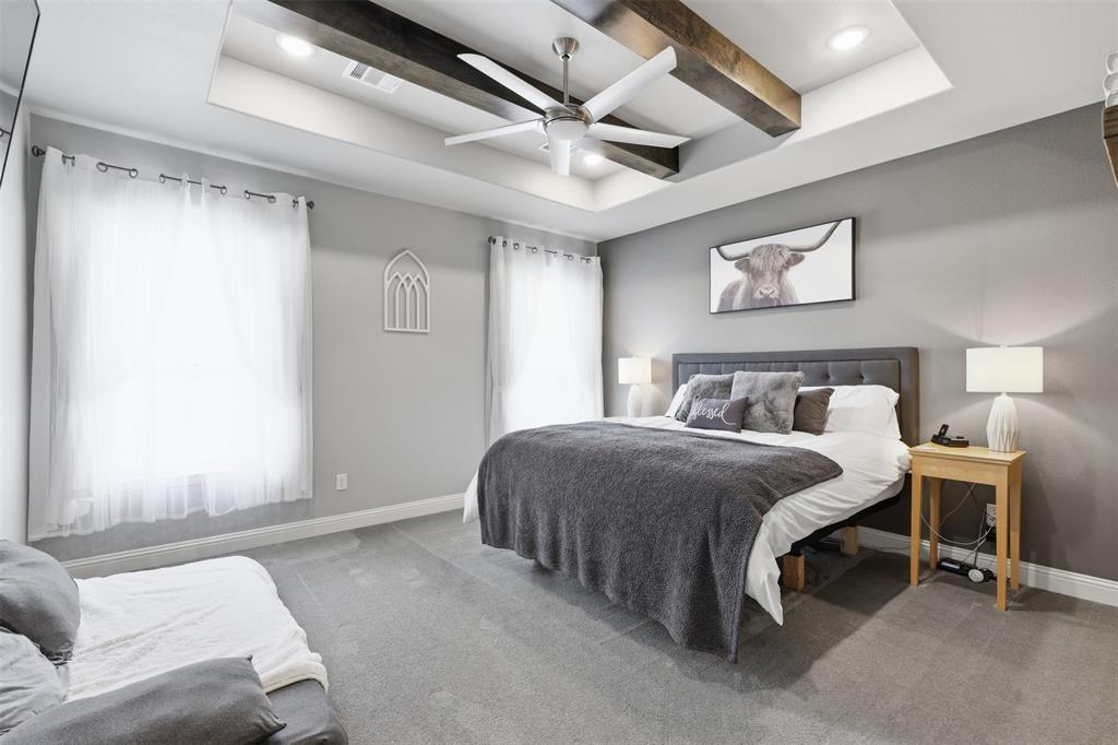 3036 Deer Path Weatherford, TX 76085 - Photo 16 of 35 a bedroom with a bed and a large window