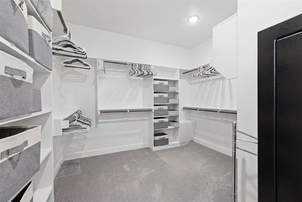 3036 Deer Path Weatherford, TX 76085 - Photo 18 of 35 a view of walk in closet with empty racks