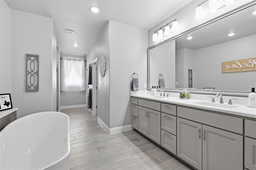 3036 Deer Path Weatherford, TX 76085 - Photo 20 of 35 a spacious bathroom with a double vanity sink mirror and double
