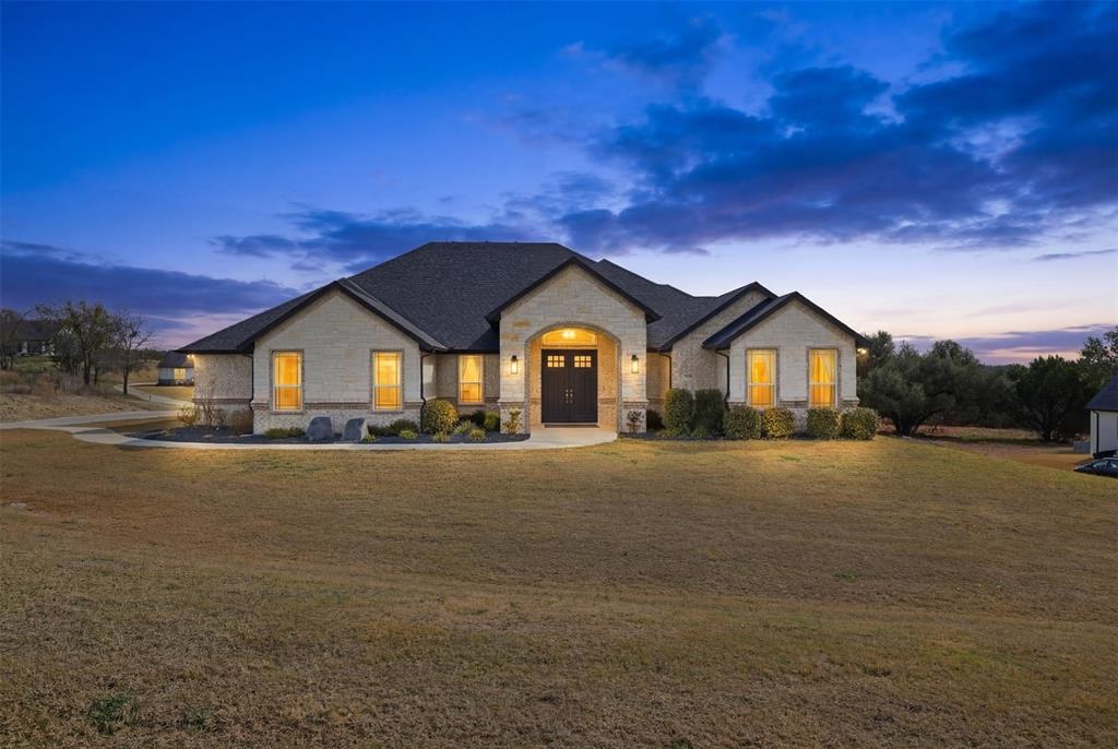 3036 Deer Path Weatherford, TX 76085 - Photo 2 of 35 a view of spacious and white house with a yard