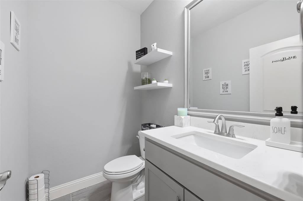 3036 Deer Path Weatherford, TX 76085 - Photo 23 of 35 a bathroom with a sink toilet and a mirror