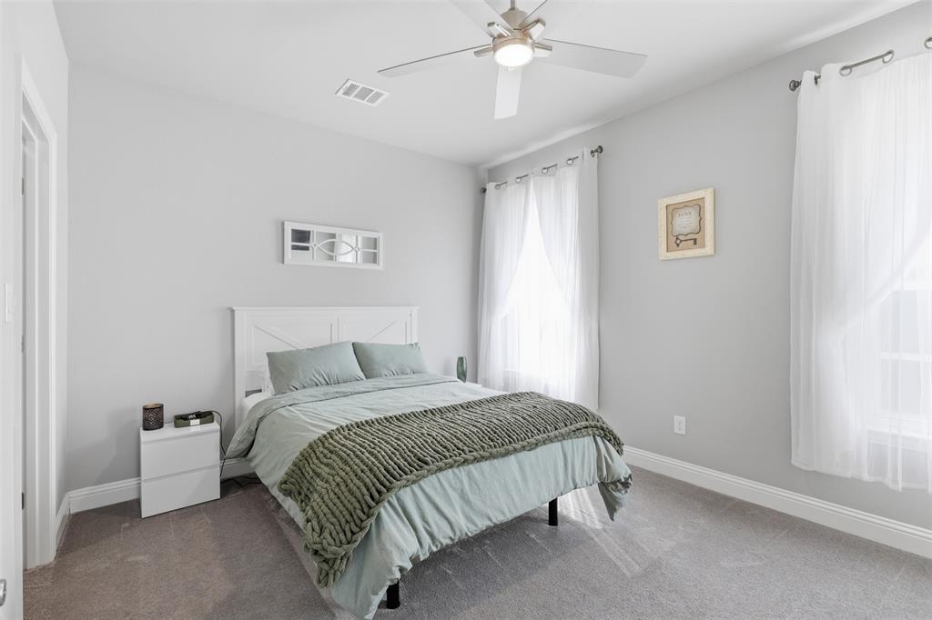 3036 Deer Path Weatherford, TX 76085 - Photo 24 of 35 a bedroom with a bed and a window