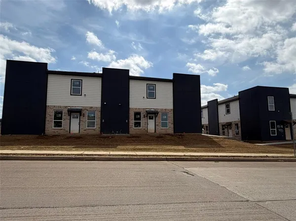 a view of a house with a street