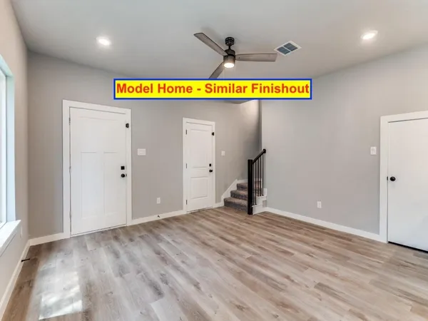 a view of a kitchen with stainless steel appliances granite countertop a refrigerator and a stove top oven