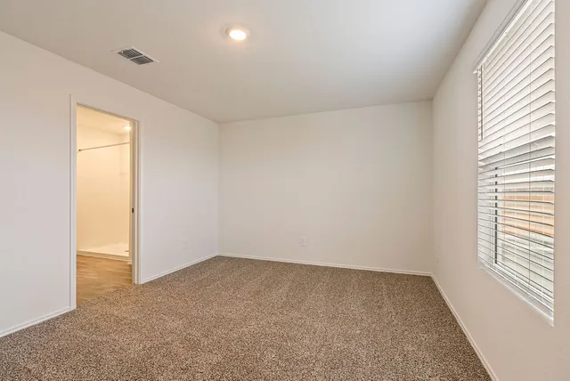 a kitchen with a stove a refrigerator and a sink