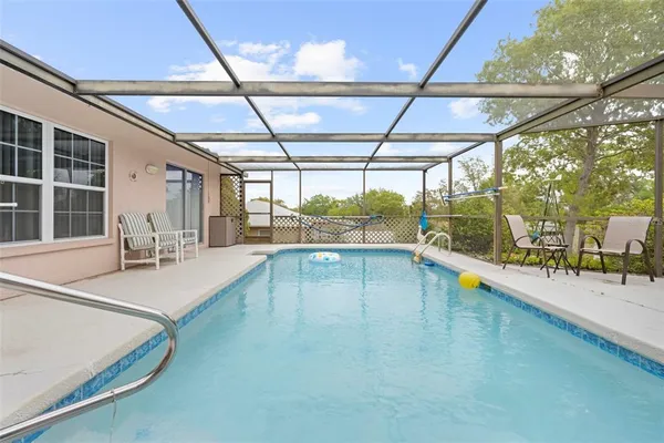 a view of a swimming pool with a patio