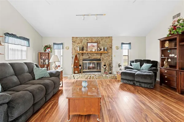 a living room with furniture and a fireplace
