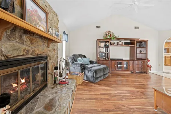 a living room with furniture and a fireplace