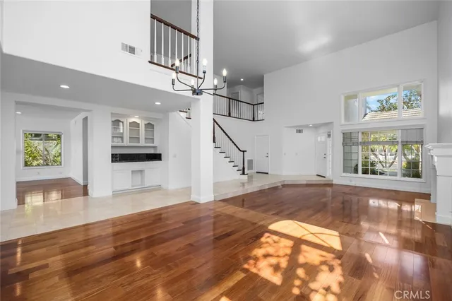 a view of an entryway with wooden floor