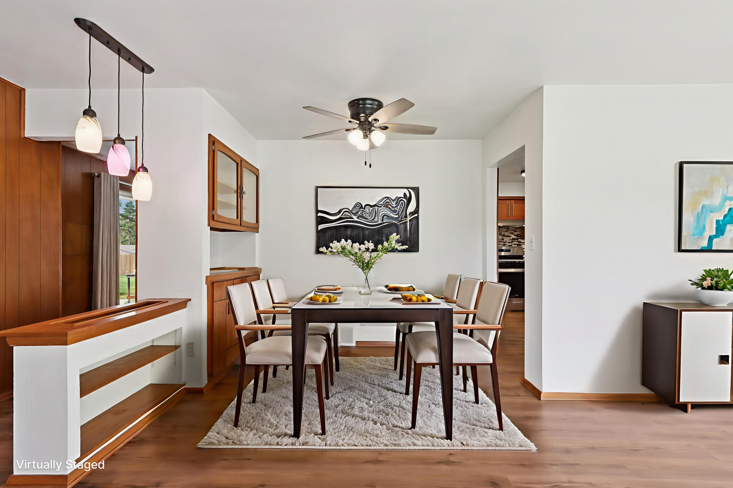 901 Anton Road Hartland, WI 53029 - Photo 9 of 48 Dining area with mid-century flair and built-in cabinets.