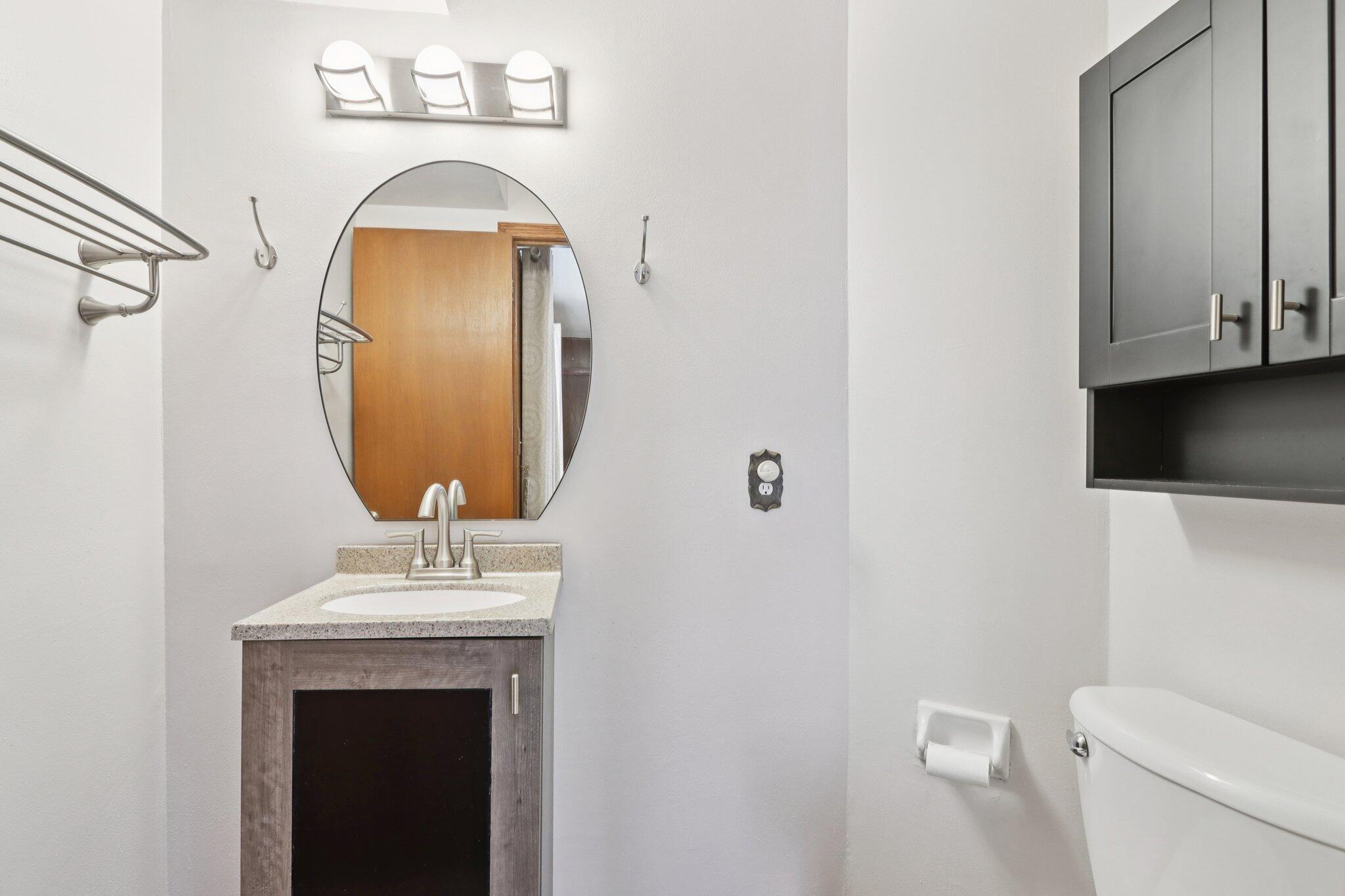 901 Anton Road Hartland, WI 53029 - Photo 17 of 48 Convenient half bath offers easy access for family and guests alike.