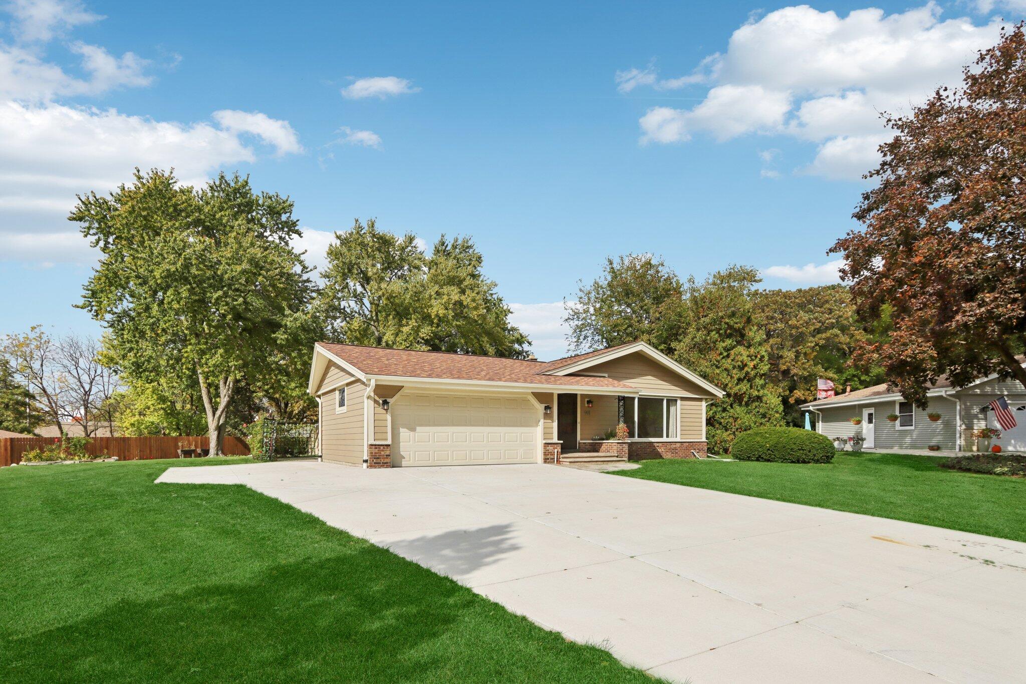 901 Anton Road Hartland, WI 53029 - Photo 4 of 48 New concrete driveway, extra parking area, patio, and walkways.