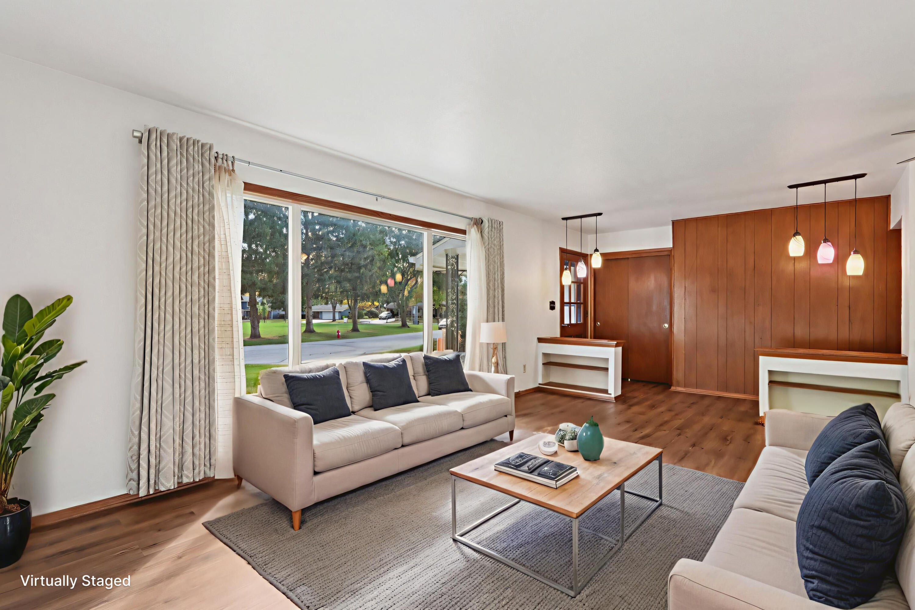 901 Anton Road Hartland, WI 53029 - Photo 5 of 48 Beautiful oversized window provides natural light with views of Louis Joliet neighborhood park.