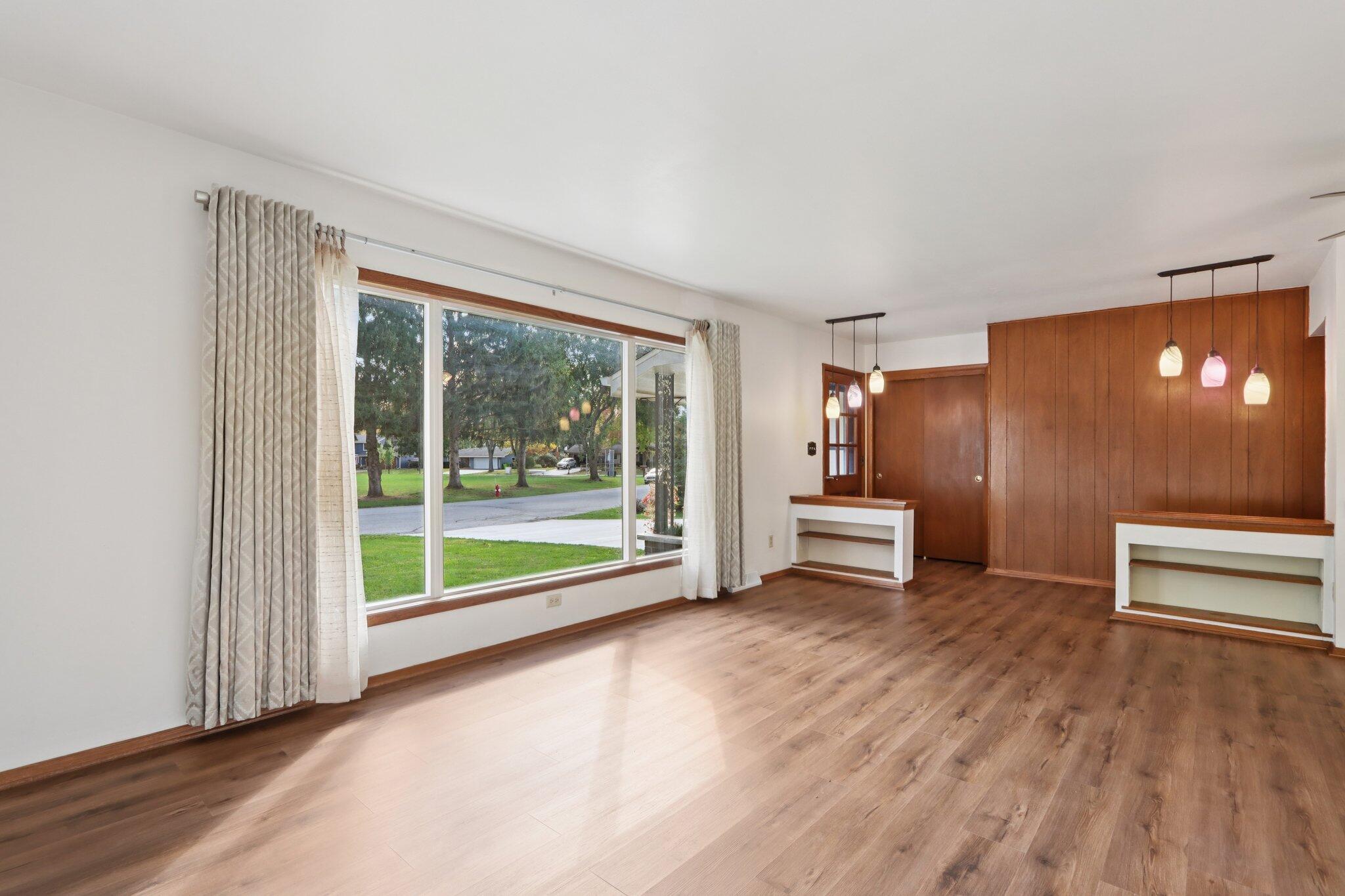 901 Anton Road Hartland, WI 53029 - Photo 6 of 48 Luxury vinyl plank flooring extends through the main living spaces.