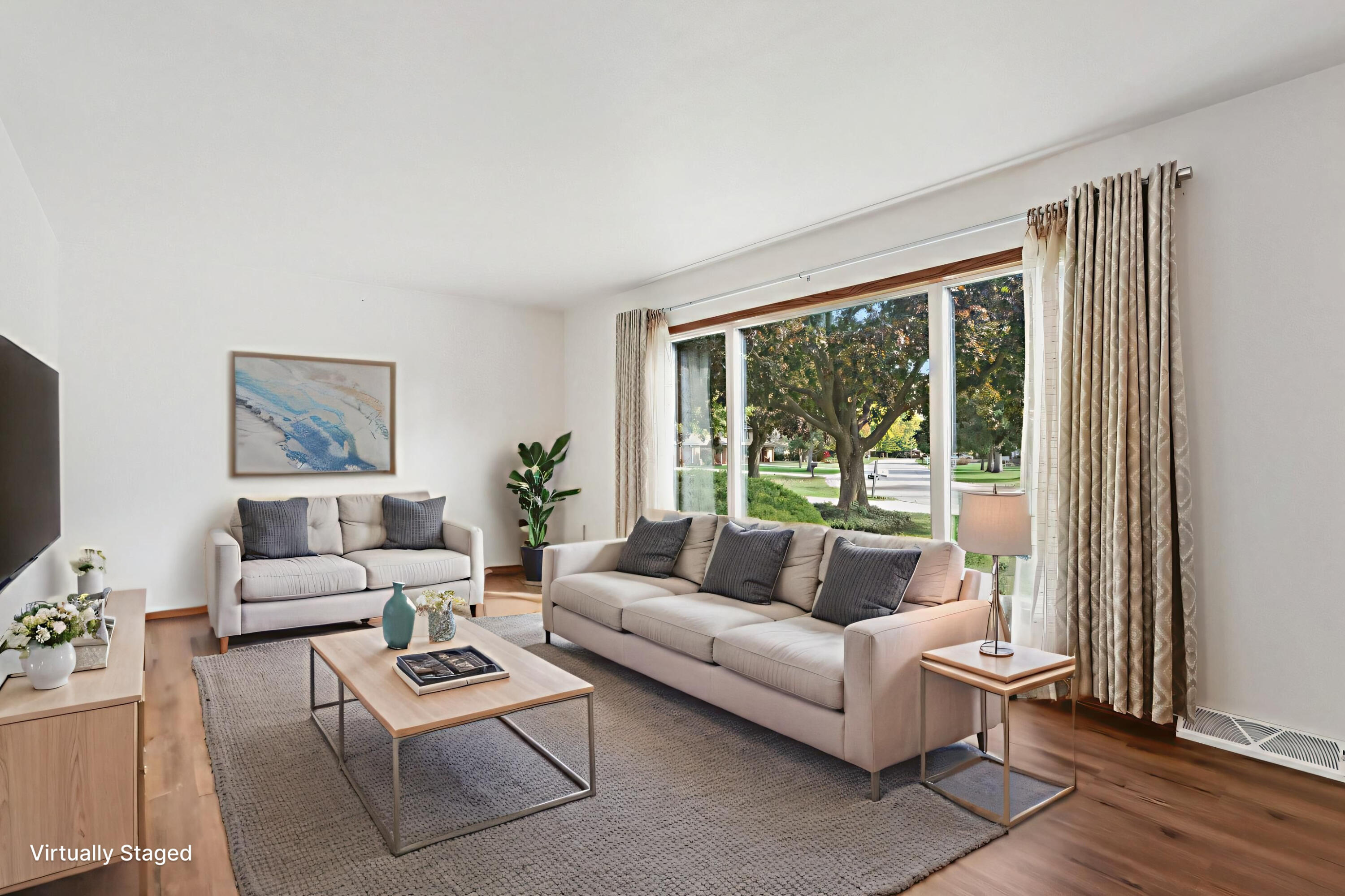 901 Anton Road Hartland, WI 53029 - Photo 7 of 48 Large living room with adjacent dining room area.