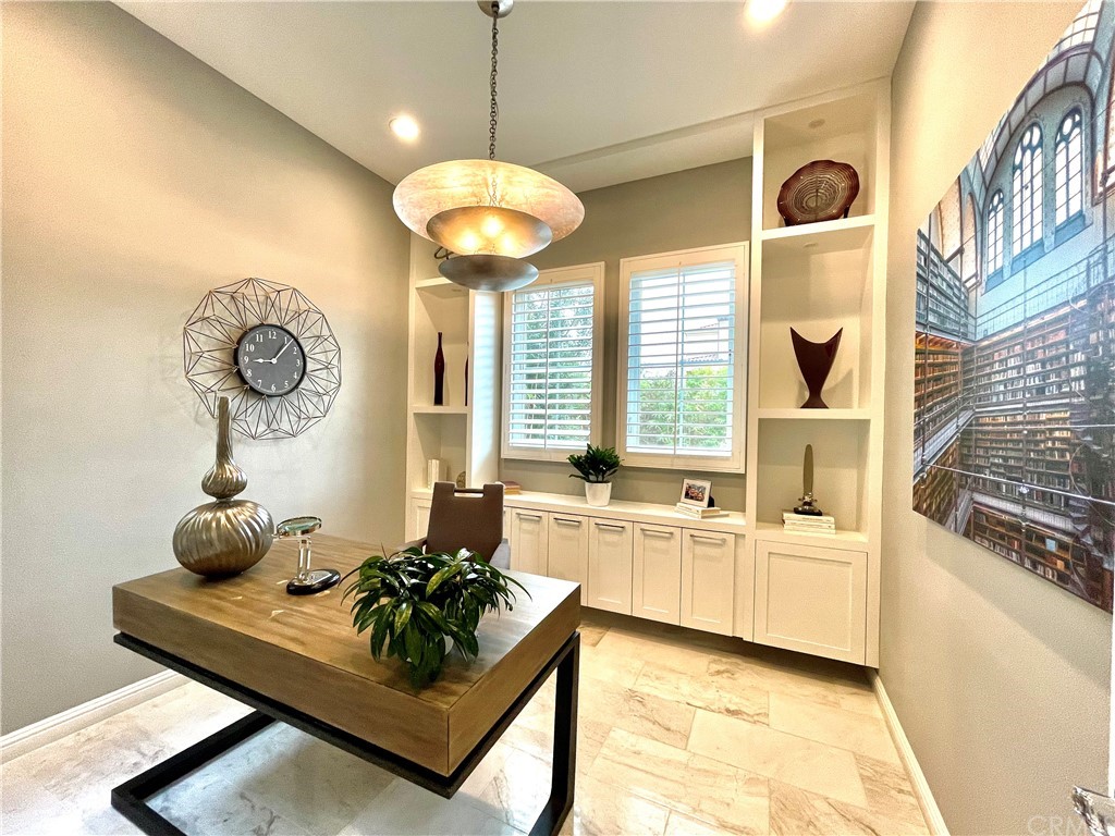 20744 Bur Oak Circle Porter Ranch, CA 91326 - Photo 13 of 36 a view of a kitchen with a sink and chandelier