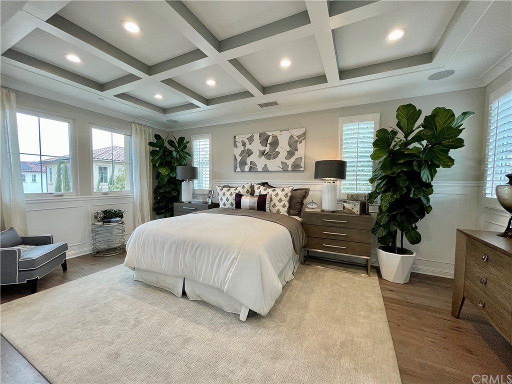 20744 Bur Oak Circle Porter Ranch, CA 91326 - Photo 19 of 36 a spacious bedroom with a large bed and a potted plant