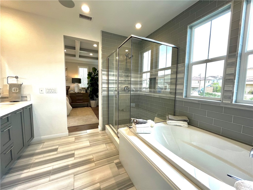 20744 Bur Oak Circle Porter Ranch, CA 91326 - Photo 21 of 36 a spacious bathroom with a tub and shower