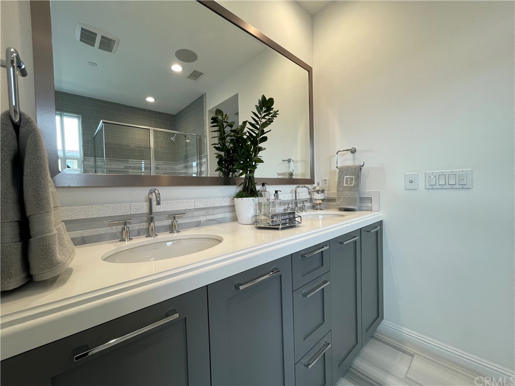 20744 Bur Oak Circle Porter Ranch, CA 91326 - Photo 23 of 36 a bathroom with a sink and a mirror
