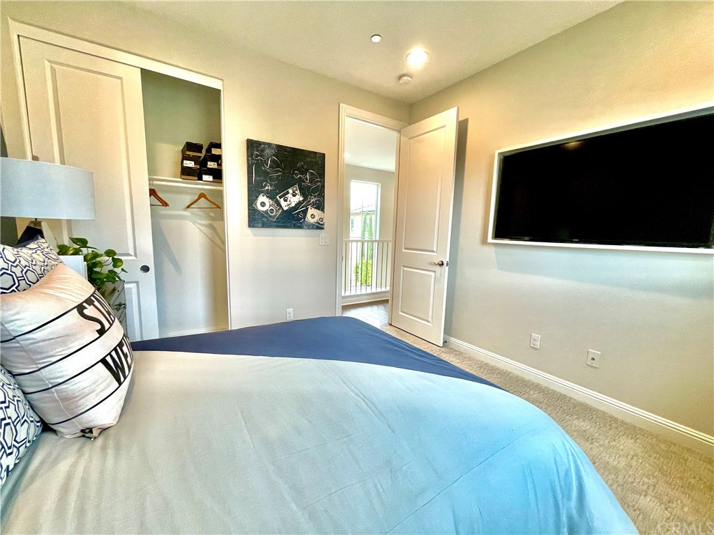 20744 Bur Oak Circle Porter Ranch, CA 91326 - Photo 26 of 36 a bedroom with a bed and a flat screen tv