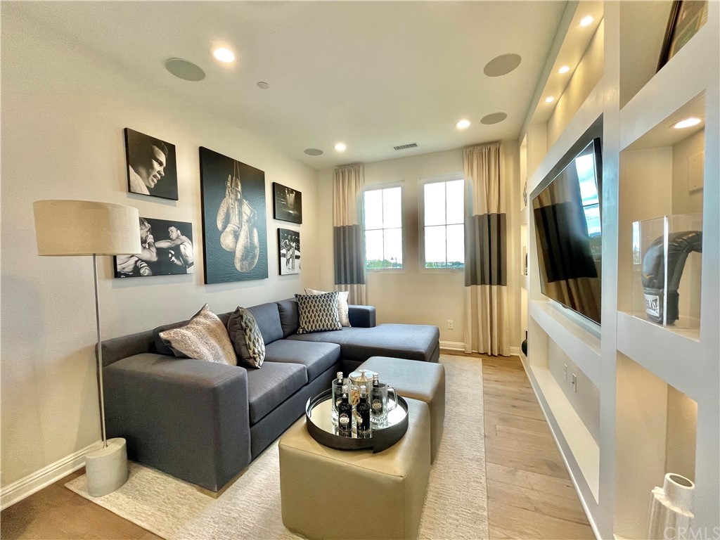 20744 Bur Oak Circle Porter Ranch, CA 91326 - Photo 29 of 36 a living room with furniture and a large window