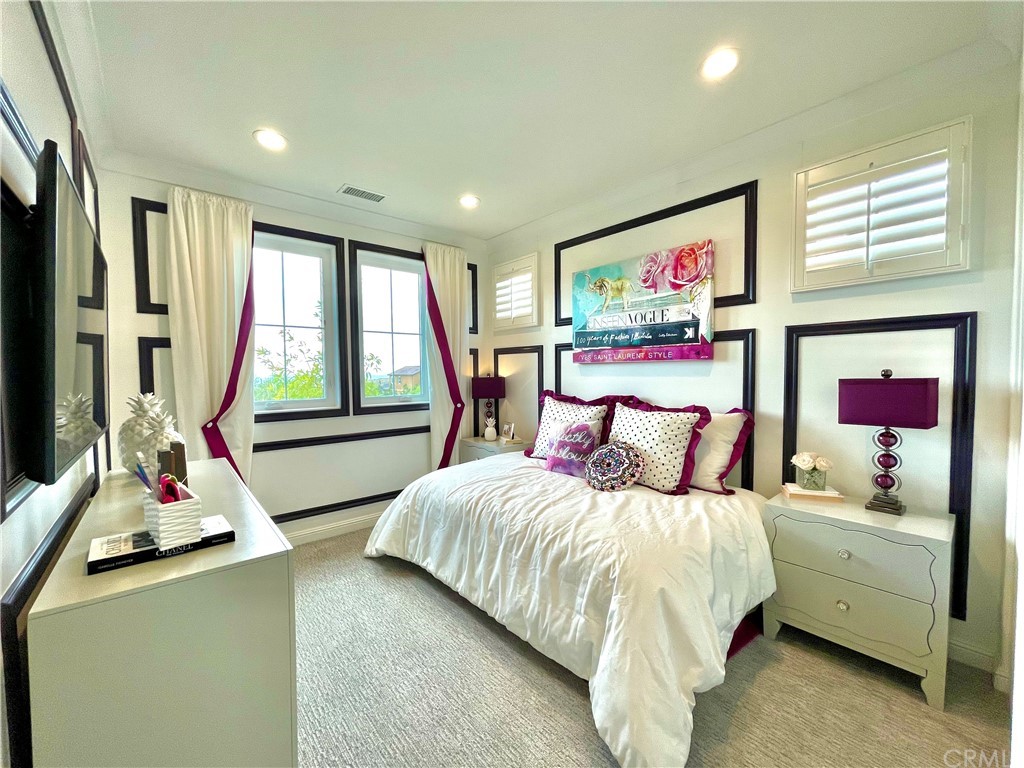 20744 Bur Oak Circle Porter Ranch, CA 91326 - Photo 30 of 36 a bedroom with a bed and a large window