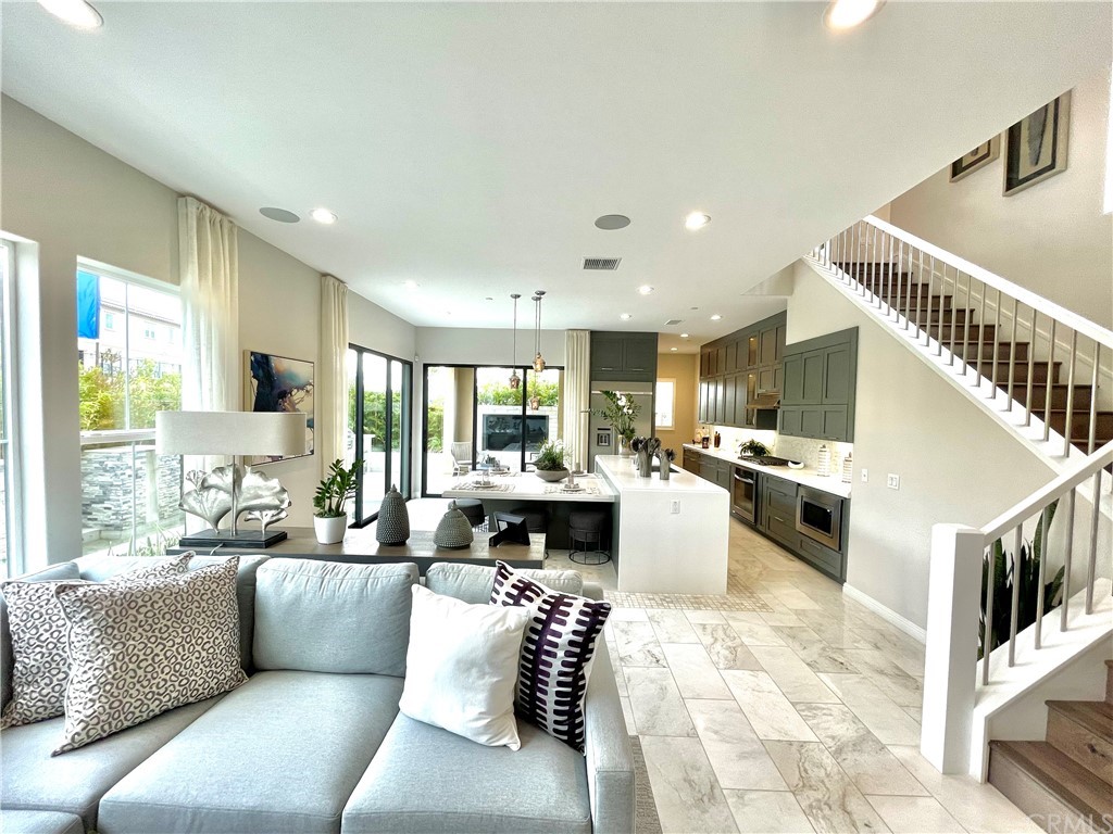 20744 Bur Oak Circle Porter Ranch, CA 91326 - Photo 4 of 36 a living room with furniture kitchen view and a large window