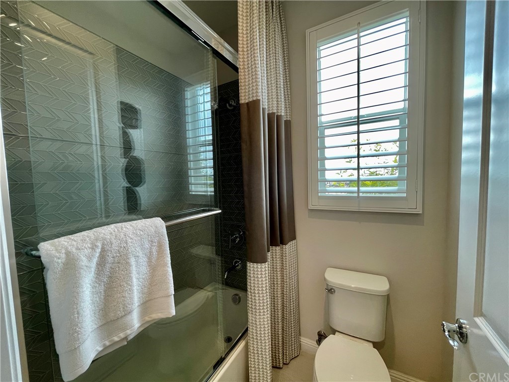 20744 Bur Oak Circle Porter Ranch, CA 91326 - Photo 31 of 36 a bathroom with a toilet and a shower