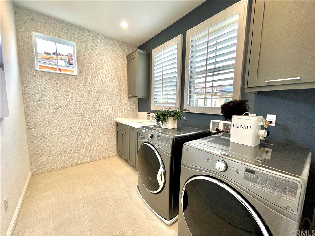 20744 Bur Oak Circle Porter Ranch, CA 91326 - Photo 32 of 36 a utility room with dryer and washer