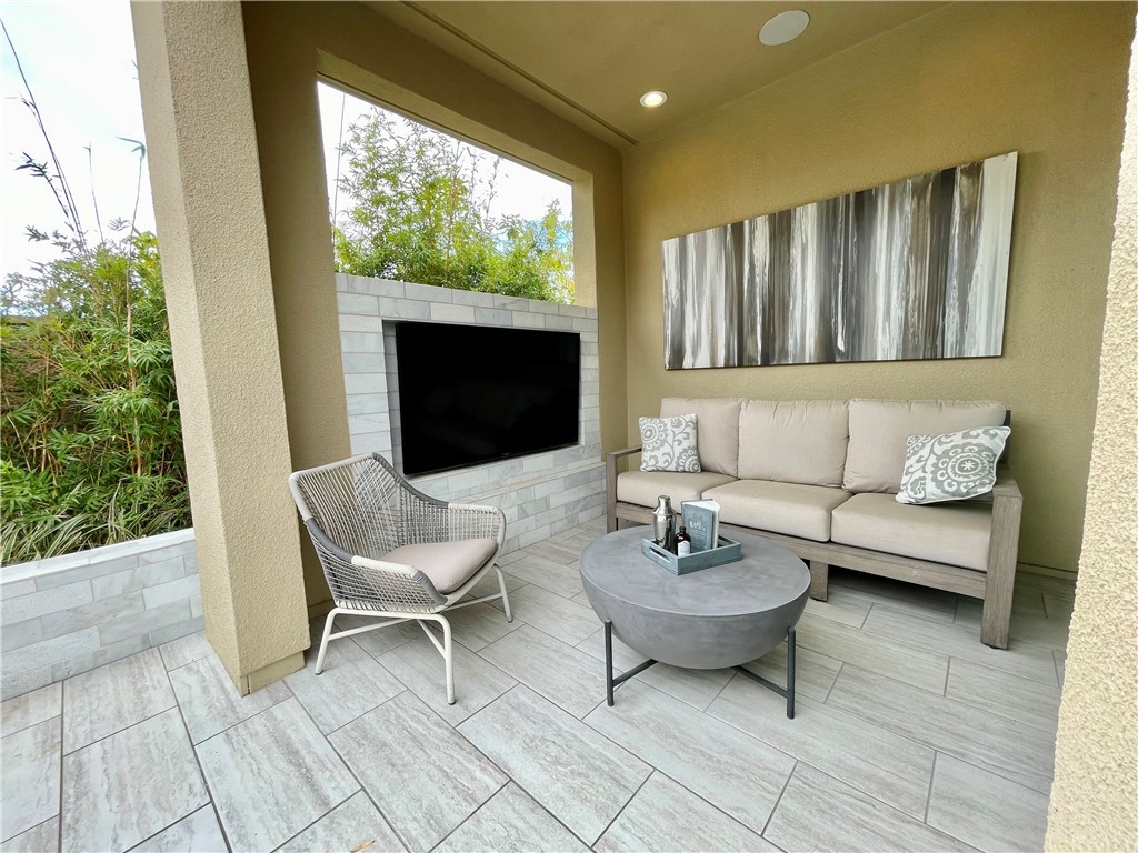 20744 Bur Oak Circle Porter Ranch, CA 91326 - Photo 35 of 36 a living room with furniture and a fireplace