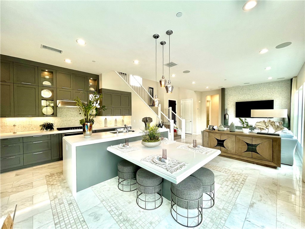 20744 Bur Oak Circle Porter Ranch, CA 91326 - Photo 9 of 36 a large kitchen with a table and chairs