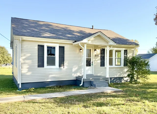 a front view of a house with a yard