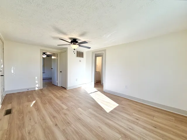 a view of a livingroom with a ceiling fan