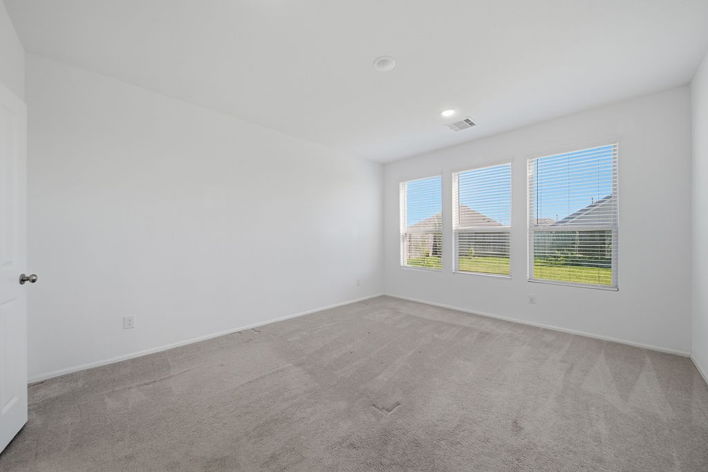 14230 Overbrook Willow Way Rosharon, TX 77583 - Photo 19 of 50 an empty room with windows