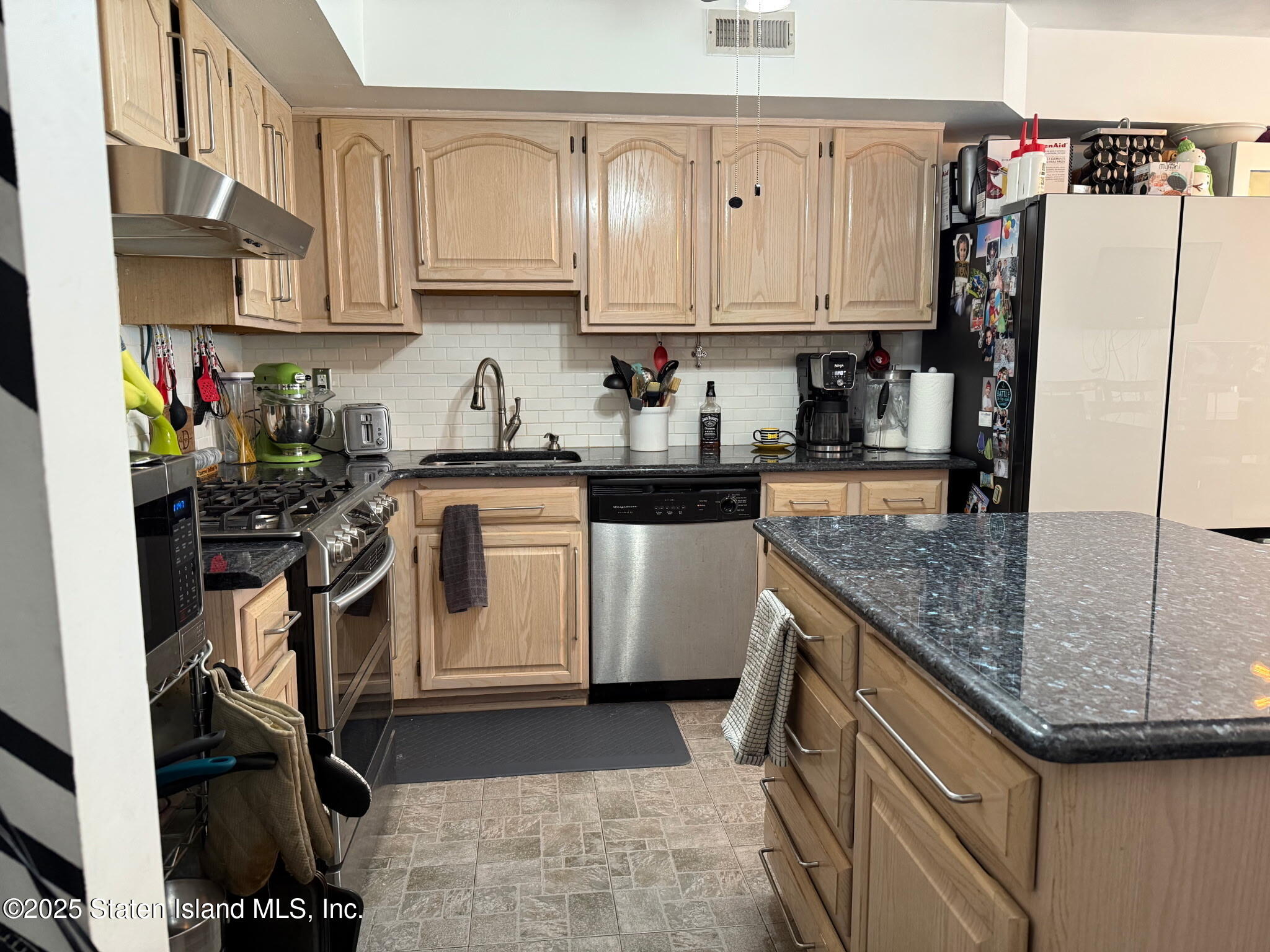 37 Linda Lane Staten Island, NY 10312 - Photo 11 of 20 a kitchen with stainless steel appliances granite countertop a sink a stove and a refrigerator