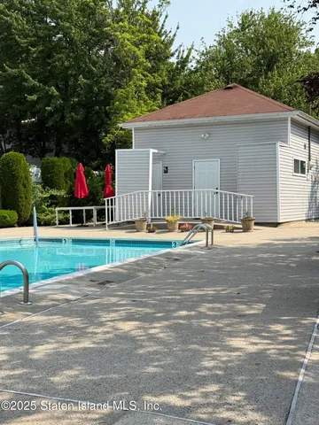 a view of basketball place with a small yard