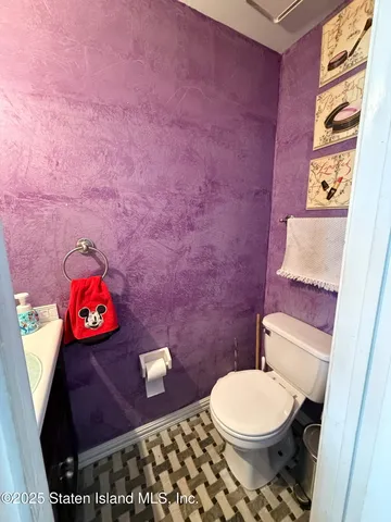 a bathroom with a toilet and a sink