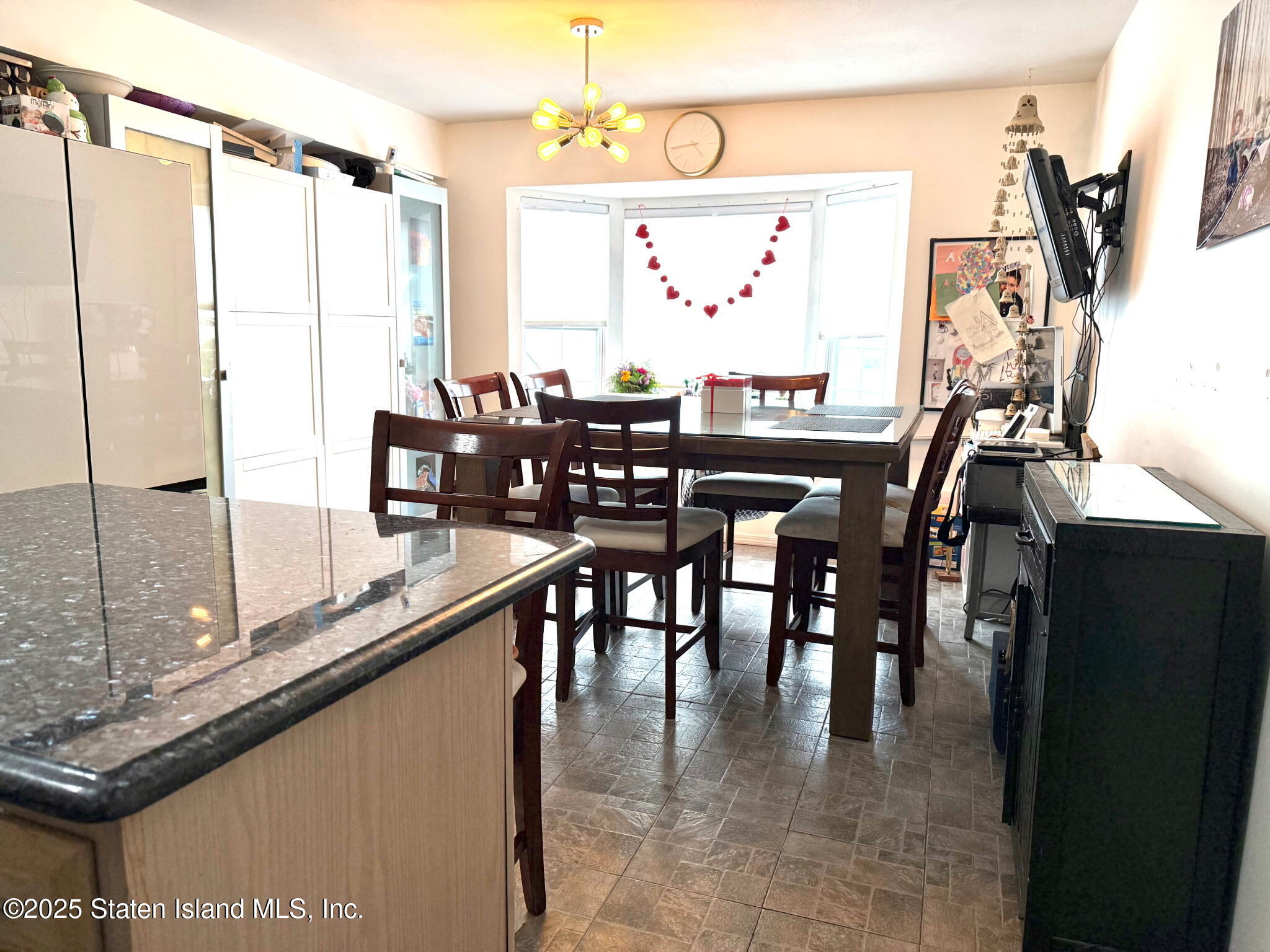 37 Linda Lane Staten Island, NY 10312 - Photo 9 of 20 a dining table with chairs and window