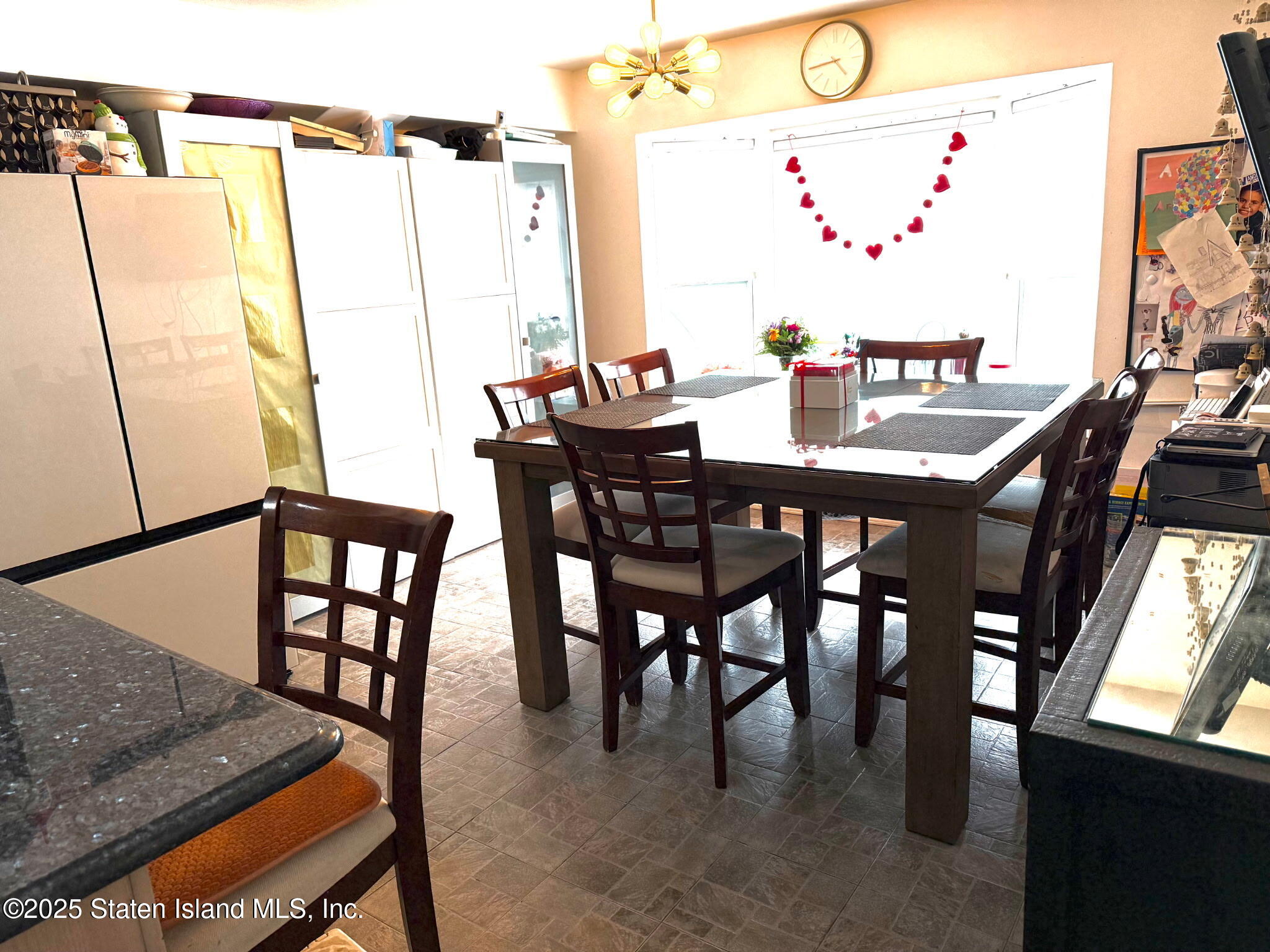 37 Linda Lane Staten Island, NY 10312 - Photo 10 of 20 a view of a dining room with furniture and a window