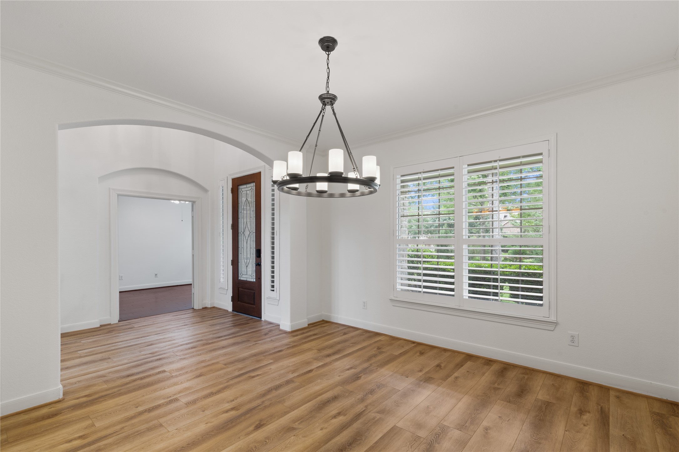 155 South Arrow Canyon Circle Spring, TX 77389 - Photo 8 of 49 This elegant dining room features a modern chandelier, and large windows with plantation shutters for natural light offers sophisticated refinement to entertain your guests.
